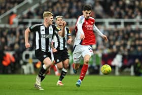 Kai Havertz of Arsenal and Lewis Hall of Newcastle United chase the ball during the Carabao Cup Semi Final Second Leg match between Newcastle United and Arsenal at St James' Park on February 05, 2025 in Newcastle upon Tyne, England. 