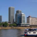 Concept art of the proposed 29-storey tower in the centre of the image, with the shorter tower partly obscured by an existing white building