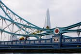 Emergency service workers respond to a man who climbed a railing on Tower Bridge 
