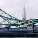 Emergency service workers respond to a man who climbed a railing on Tower Bridge 