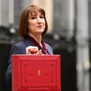 Rachel Reeves, poses with the red Budget Box as she leaves 11 Downing Street to present the government's annual budget to Parliament in October 2024.
