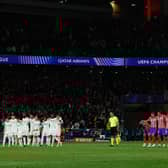 Real Madrid and Atletico Madrid players stand during the penalty shootout during the UEFA Champions League Round of 16 second leg football match between Club Atletico de Madrid and Real Madrid CF at the Metropolitano stadium in Madrid on March 12, 2025. 