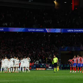 Real Madrid and Atletico Madrid players stand during the penalty shootout during the UEFA Champions League Round of 16 second leg football match between Club Atletico de Madrid and Real Madrid CF at the Metropolitano stadium in Madrid on March 12, 2025. 