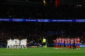 Real Madrid and Atletico Madrid players stand during the penalty shootout during the UEFA Champions League Round of 16 second leg football match between Club Atletico de Madrid and Real Madrid CF at the Metropolitano stadium in Madrid on March 12, 2025. 