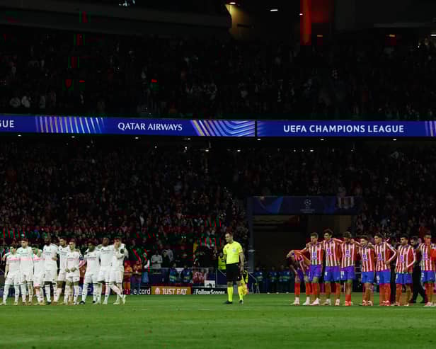 Real Madrid and Atletico Madrid players stand during the penalty shootout during the UEFA Champions League Round of 16 second leg football match between Club Atletico de Madrid and Real Madrid CF at the Metropolitano stadium in Madrid on March 12, 2025. 