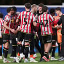 Chris Wilder, Sheffield United manager shakes hands with his players  after the final whistle in the Sky Bet Championship match between Queens Park Rangers FC and Sheffield United FC at Loftus Road on March 01, 2025 in London, England. 