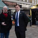Councillors Geoff Barraclough (L) and Ed Pitt Ford standing at the site in Tachbrook Market, Pimlico, where they saved a man's life through CPR