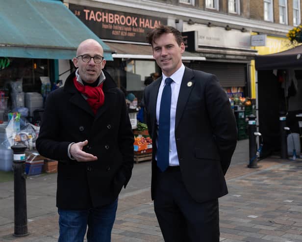Councillors Geoff Barraclough (L) and Ed Pitt Ford standing at the site in Tachbrook Market, Pimlico, where they saved a man's life through CPR