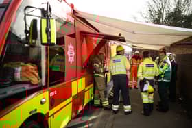 Electrical engineers gather to discuss their progress near the site of the fire at North Hyde electricity substation, at Hayes on March 21, 2025