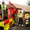 Electrical engineers gather to discuss their progress near the site of the fire at North Hyde electricity substation, at Hayes on March 21, 2025