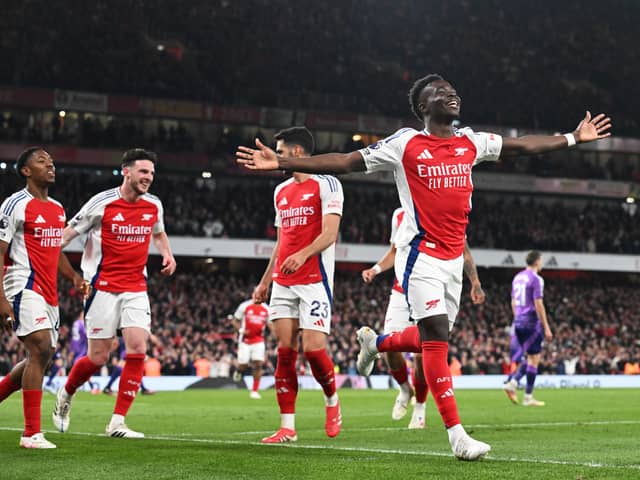 Bukayo Saka of Arsenal celebrates scoring his team's second goal during the Premier League match between Arsenal FC and Fulham FC at Emirates Stadium on April 01, 2025 in London, England.