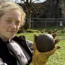 Magnet Fishing Edinburgh's Eryn and the 350-year-old cannonball found in the River Lochy in the Scottish Highlands. 