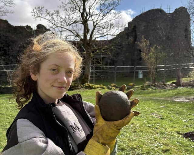 Magnet Fishing Edinburgh's Eryn and the 350-year-old cannonball found in the River Lochy in the Scottish Highlands. 