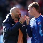 Enzo Maresca, Manager of Chelsea, interacts with Cole Palmer of Chelsea after the Premier League match between Brentford FC and Chelsea FC at Gtech Community Stadium on April 06, 2025 in Brentford, England.