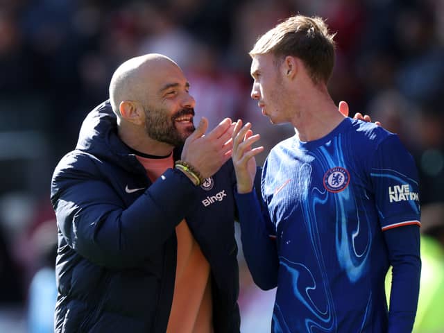 Enzo Maresca, Manager of Chelsea, interacts with Cole Palmer of Chelsea after the Premier League match between Brentford FC and Chelsea FC at Gtech Community Stadium on April 06, 2025 in Brentford, England.