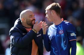 Enzo Maresca, Manager of Chelsea, interacts with Cole Palmer of Chelsea after the Premier League match between Brentford FC and Chelsea FC at Gtech Community Stadium on April 06, 2025 in Brentford, England.