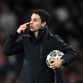 Mikel Arteta, Manager of Arsenal, gestures whilst giving the team instructions as he holds the match ball during the UEFA Champions League 2024/25 Quarter Final First Leg match between Arsenal FC and Real Madrid C.F. at Emirates Stadium on April 08, 2025 in London, England.