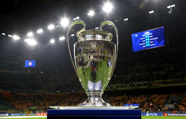 The UEFA Champions League trophy is displayed on a plinth at the side of the pitch prior to the UEFA Champions League 2024/25 UEFA Champions League 2024/25 Round of 16 Second Leg match between FC Internazionale Milano and Feyenoord at Stadio San Siro on March 11, 2025 in Milan, Italy.