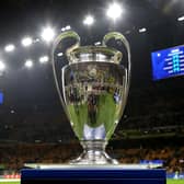 The UEFA Champions League trophy is displayed on a plinth at the side of the pitch prior to the UEFA Champions League 2024/25 UEFA Champions League 2024/25 Round of 16 Second Leg match between FC Internazionale Milano and Feyenoord at Stadio San Siro on March 11, 2025 in Milan, Italy.