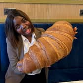 Emmanuella Okpoko with the massive croissant at P&D Gran Caffè in Liverpool.