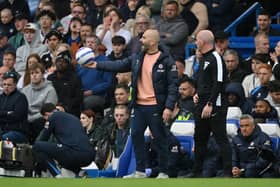 Enzo Maresca, Manager of Chelsea, reacts with the ball during the Premier League match between Chelsea FC and Ipswich Town FC at Stamford Bridge on April 13, 2025 in London, England.
