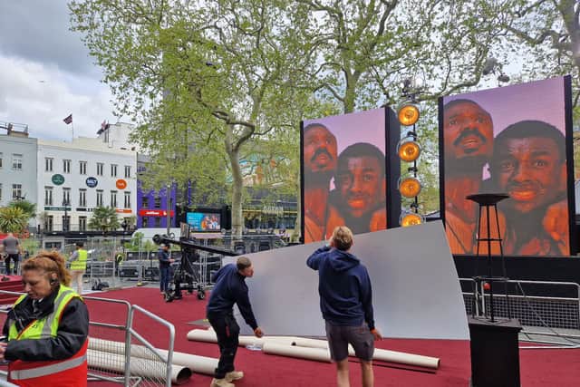 Staff are setting up the red carpet in London's Leicester Square 
