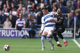 Harrison Ashby of QPR battles Ronald of Swansea City.