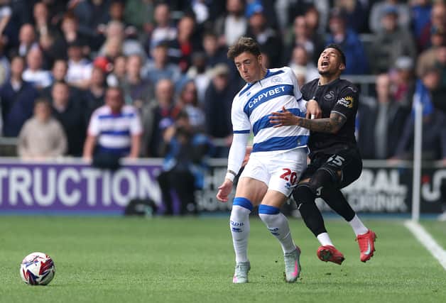 Harrison Ashby of QPR battles Ronald of Swansea City.