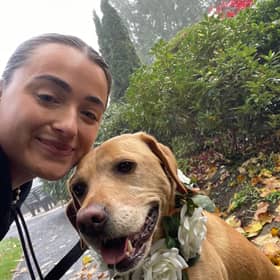 Rebecca McBride, chaperoning a dog.