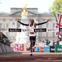 First placed Sabastian Sawe of Team Kenya celebrates as he approaches the finish line to win the Men's 2025 TCS London Marathon on April 27, 2025