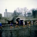 General view of competitors as they pass the Tower of London during the First London Marathon in 1981