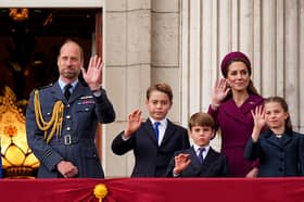 Prince William, Prince of Wales, Prince George, Prince Louis, Catherine, Princess of Wales, and Princess Charlotte on the balcony of Buckingham Palace to view the fly past