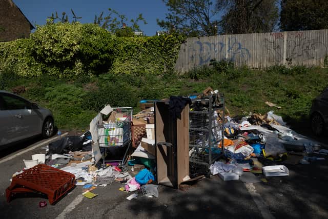The rubbish and 'unauthorised encampments' in the car park have spilled over into parking bays