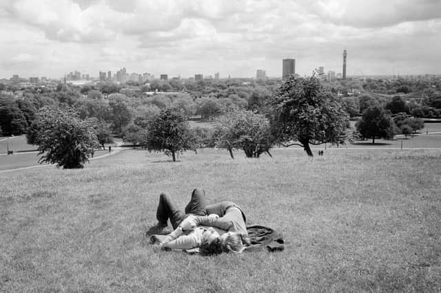 A couple cuddles on Primrose Hill in London (2006)