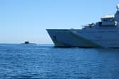 A “secret weapon” is being developed and could be used by Royal Navy technicians to search for Russian submarines. Pictured: HMS Tyne with Russian Kilo-class submarine Krasnodar in the background.