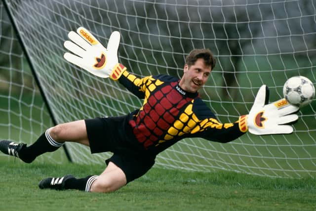  Arsenal goalkeeper David Seaman in action with oversized gloves during an Adidas coaching session circa 1993. 