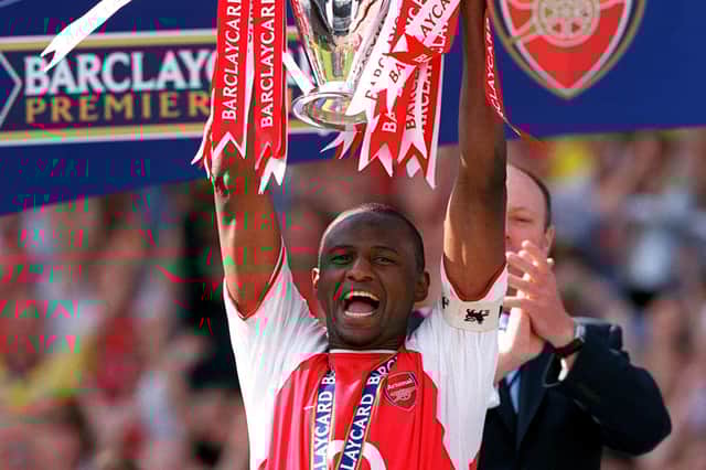 Captain Patrick Vieira of Arsenal lifts the Premiership trophy during the FA Barclaycard Premiership match between Arsenal and Leicester City at Highbury on May 15, 2004