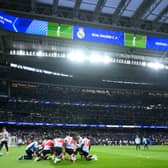 General view inside the stadium as Arsenal players warm up prior to the UEFA Champions League 2024/25 Quarter Final Second Leg match between Real Madrid C.F. and Arsenal FC at Estadio Santiago Bernabeu on April 16, 2025 in Madrid, Spain. 