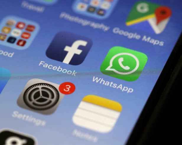 WhatsApp app on an older iPhone model
