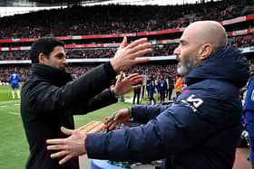 Mikel Arteta, Manager of Arsenal, and Enzo Maresca, Manager of Chelsea, embrace prior to the Premier League match between Arsenal FC and Chelsea FC at Emirates Stadium on March 16, 2025 in London, England. 