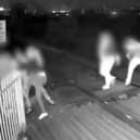 Men hold shut gates of level crossing in Barnsley, South Yorkshire.