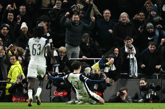 Mikey Moore celebrates scoring for Tottenham in the Champions League.