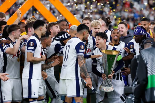 Spurs lift the Europa League trophy.