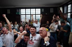 Spurs fans celebrate after their team went 1-0 up in the Beehive Pub, Tottenham