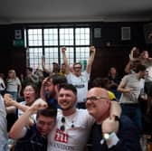 Spurs fans celebrate after their team went 1-0 up in the Beehive Pub, Tottenham