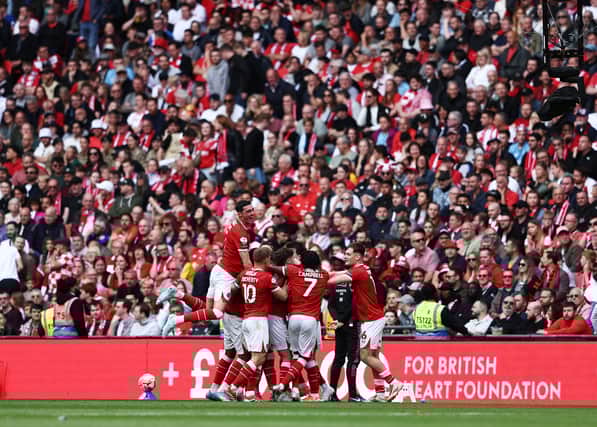 Charlton Athletic celebrate scoring at Wembley Stadium.