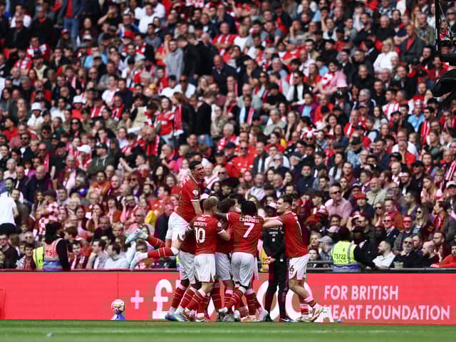 Charlton Athletic celebrate scoring at Wembley Stadium.