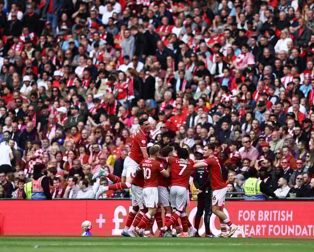 Charlton Athletic celebrate scoring at Wembley Stadium.