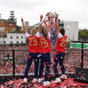 Kyra Cooney-Cross, Steph Catley and Caitlin Foord of Arsenal celebrate with the UEFA Women's Champions League trophy during celebrations at Emirates Stadium on May 26, 2025 in London