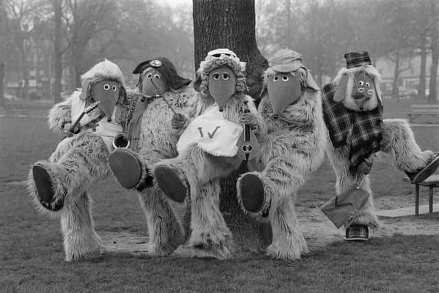 Children's TV show spin-off band The Wombles, posing on Wimbledon Common, London, 1974.